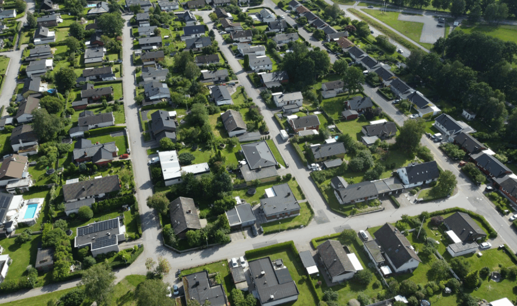 Aerial view of a suburban housing estate, reflecting how a base rate cut could shape property decisions in 2026.
