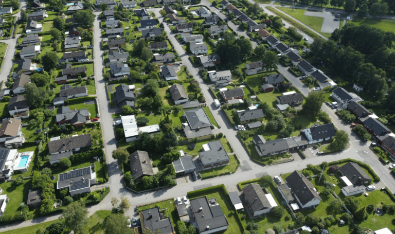 Aerial view of a suburban housing estate, reflecting how a base rate cut could shape property decisions in 2026.