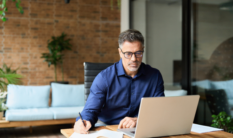 Landlord reviewing rental figures and completing a Section 13 rent increase notice under the Renters’ Rights Act 2025