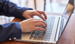 Landlord reading property market news at home